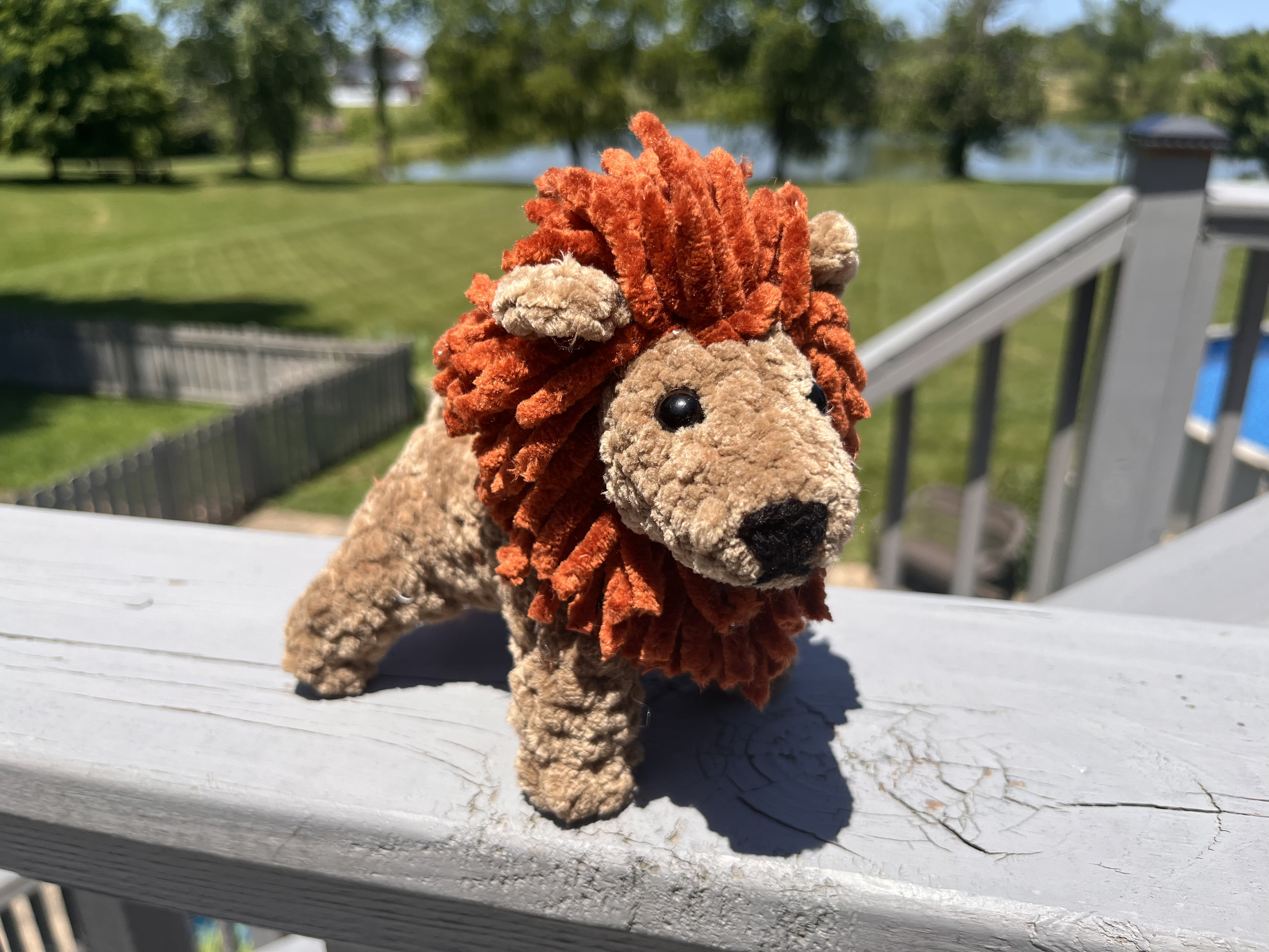 Photo of a small crocheted lion.